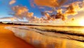 Fototapeta morze i plaża o zachodzie słońca