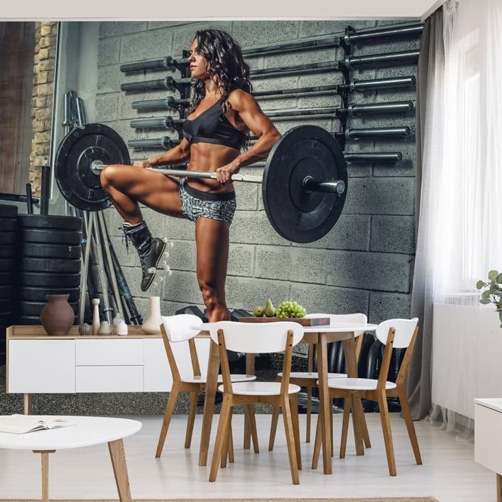 Fototapeta Wysportowana kobieta podnosząca sztangę