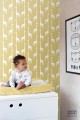 Tapeta na flizelinie żółta w białe sylwetki żyraf