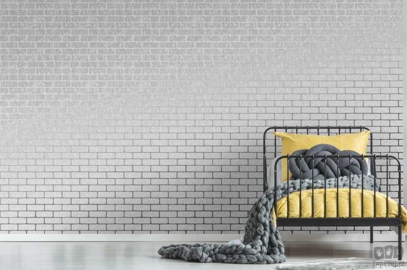 Szara tapeta z efektem cegieł i srebrnymi liniami